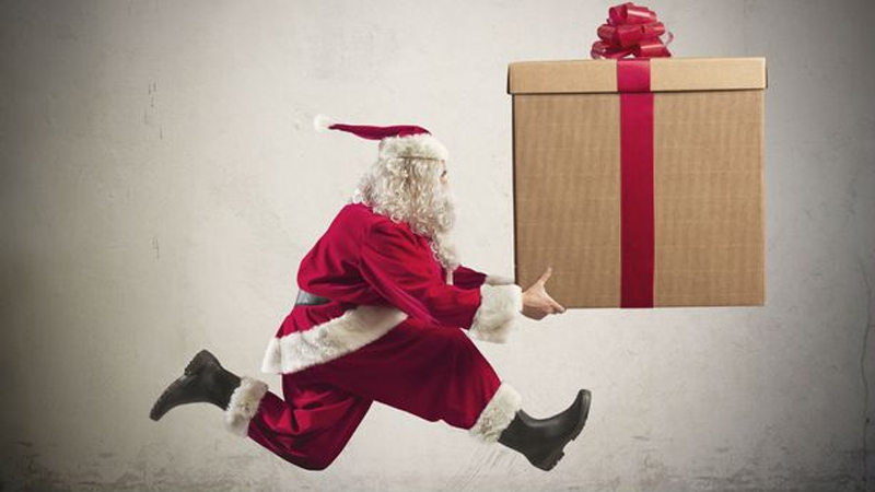 Santa running with a big parcel
